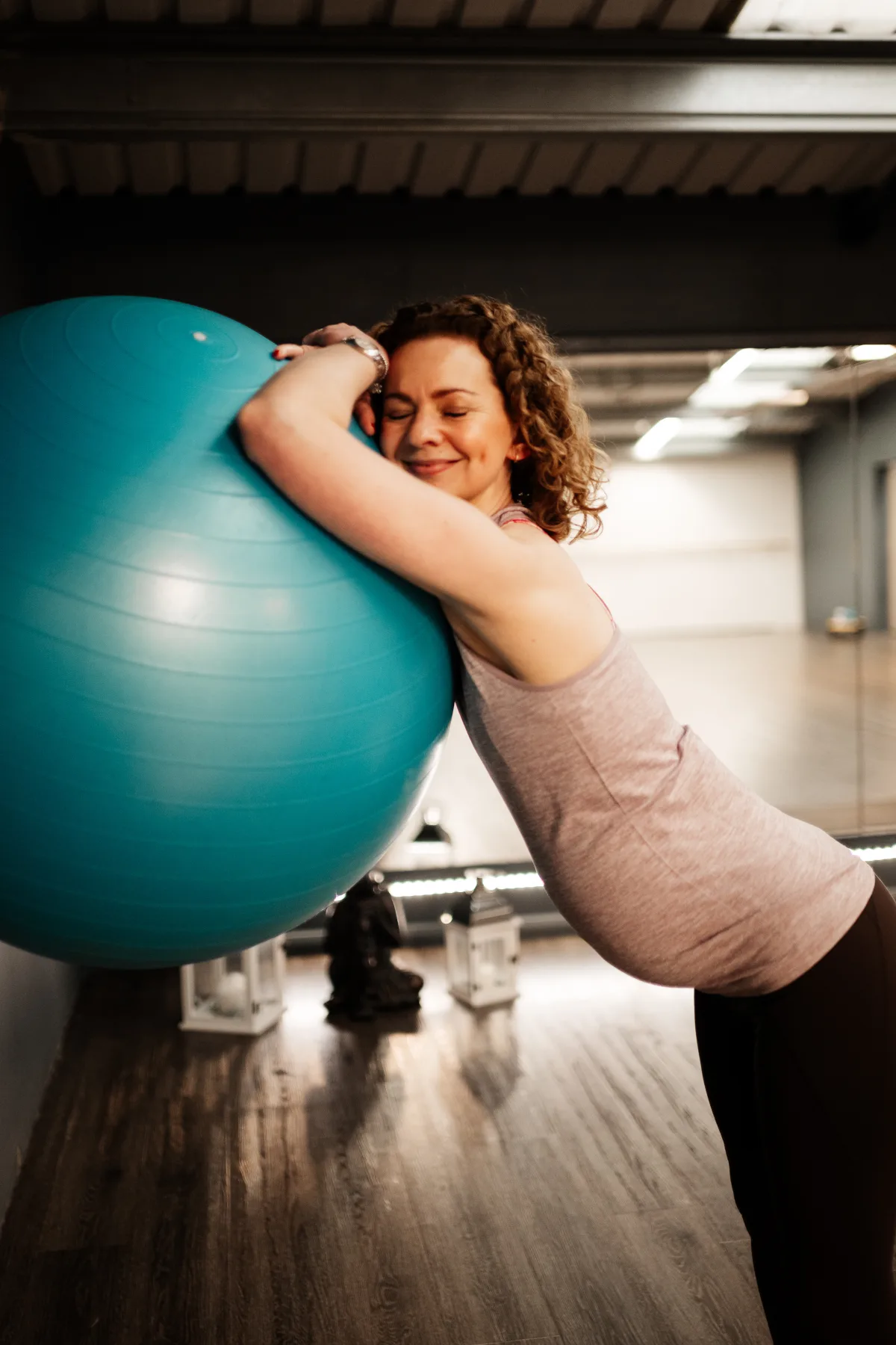 A mum-to-be resting on a birthing ball